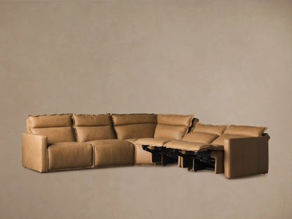 Rowland Leather Five-Piece Motion Corner Sectional in tan leather, featuring five cushioned seats with one reclined and extended footrest on the right.