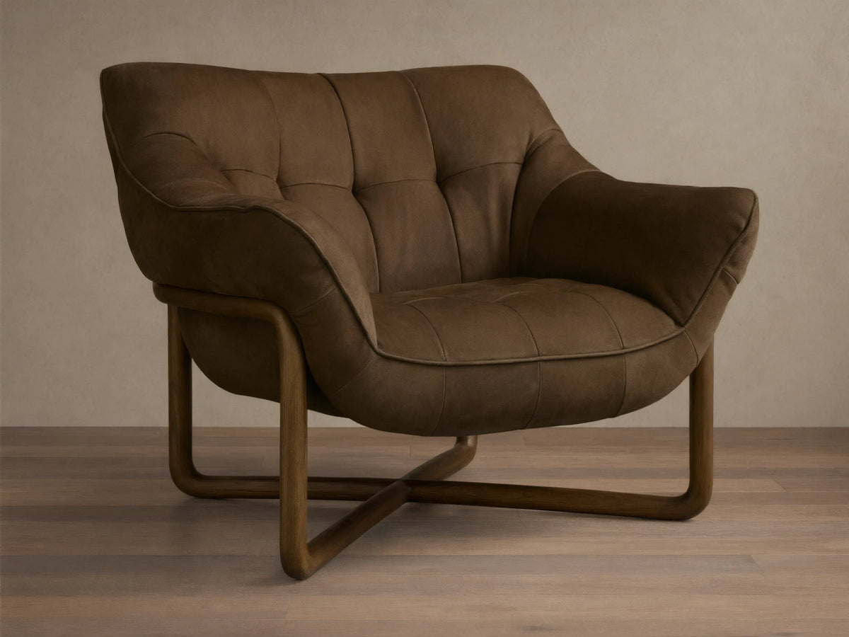 Front view of a dark brown distressed leather lounge chair with deep tufting, piping, and a curved wooden frame.
