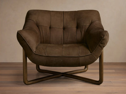 Front view of a dark brown distressed leather lounge chair with deep tufting, piping, and a curved wooden frame.