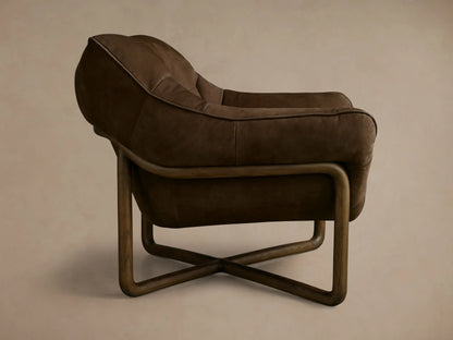 Back and side view of a brown leather armchair featuring a deeply cushioned, curved back and a light brown wooden support frame.