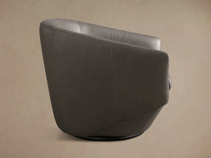 Front view of the dark gray Pelton Leather Swivel Chair, featuring a rounded barrel back, tapered base, and separate seat cushion.