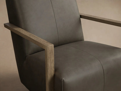Front view of the Taupe Walsh Leather Swivel Glider with light wood arms and a black swivel base.