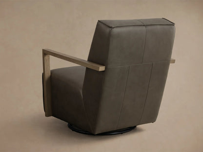 Close-up view of the dark gray leather Walsh Leather Swivel Glider with light brown wooden armrests, highlighting the smooth texture.