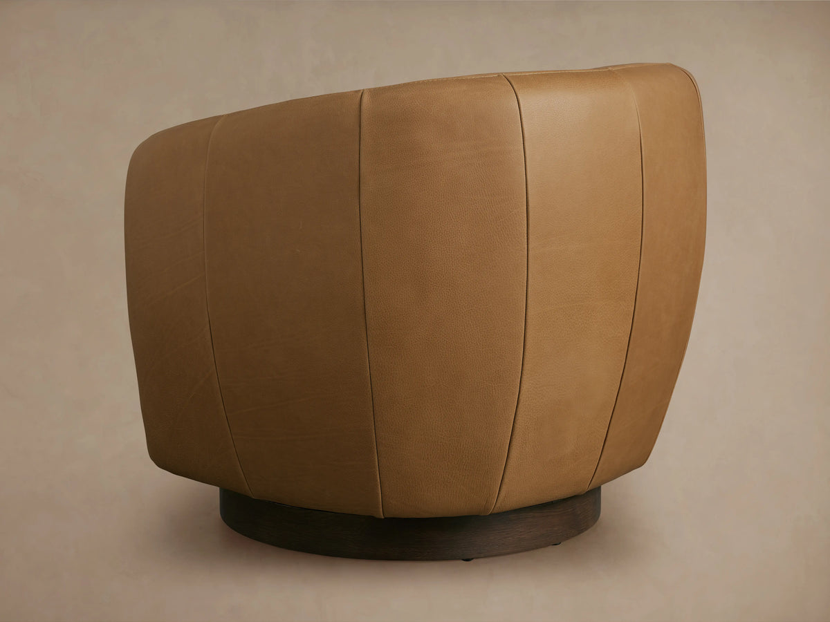 Cerrito Leather Swivel Chair in tan, close-up of armrest and seat, showing smooth leather texture and stitching detail.