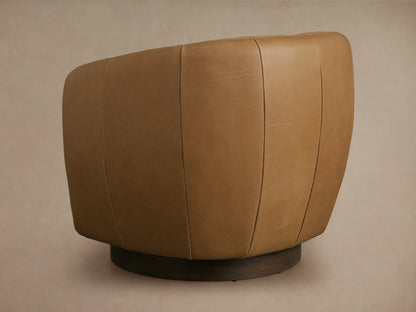 Cerrito Leather Swivel Chair in tan, close-up of armrest and seat, showing smooth leather texture and stitching detail.