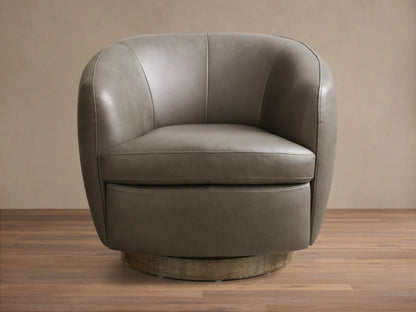 Front view of the taupe Cerrito Leather Swivel Chair, featuring curved arms and back, with a round wooden swivel base.