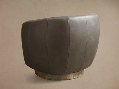 Rear view of the taupe Cerrito Leather Swivel Chair, featuring vertical seam details and a textured golden swivel base.