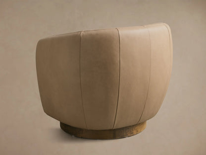 Rear view of the light tan Cerrito Leather Swivel Chair, featuring vertical panel stitching and a dark wooden swivel base.