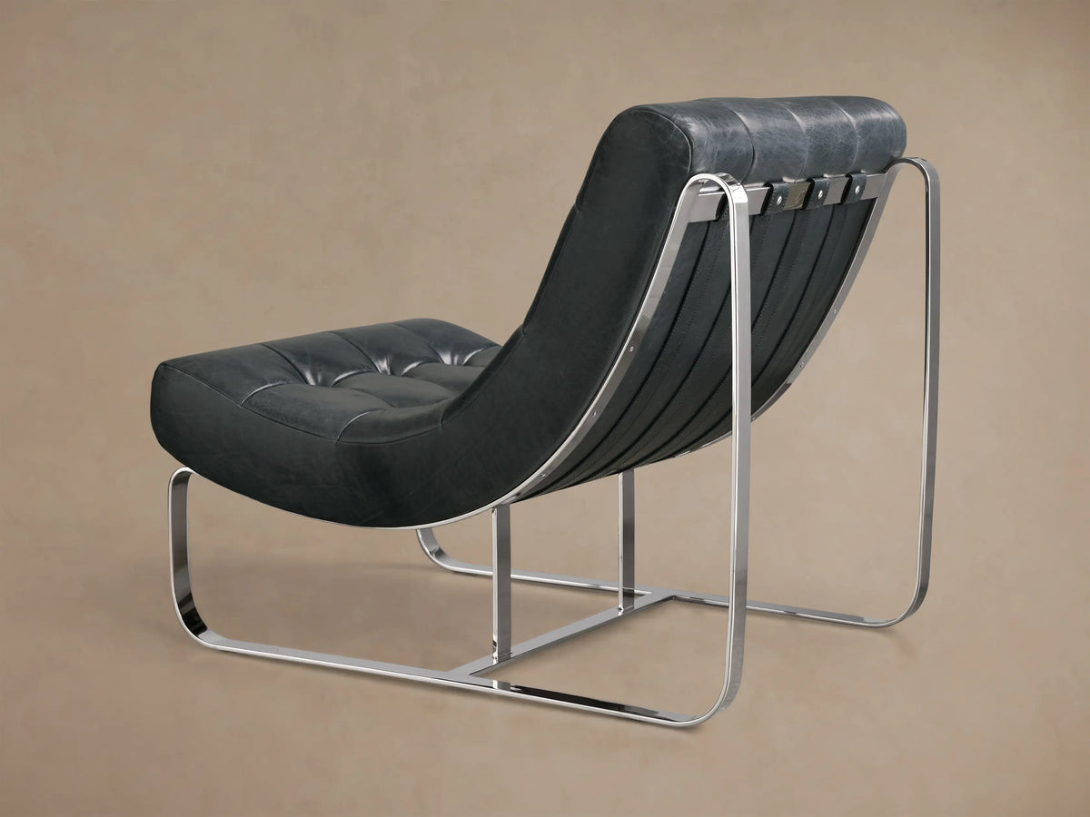 Close-up of the quilted dark green leather back of a Callaway Leather Chair, featuring vertical straps, silver bars, and a curved frame.