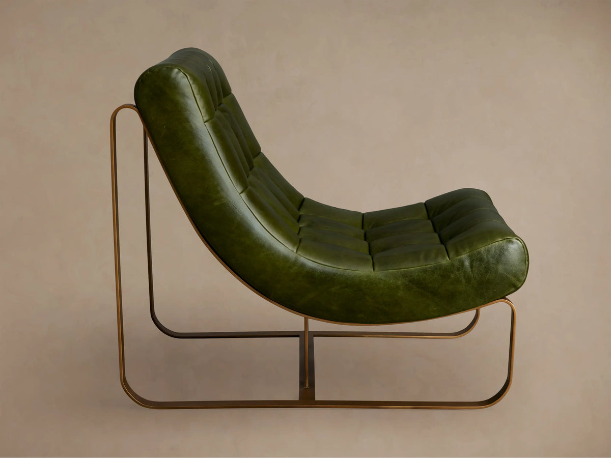 Callaway Chair in green leather, side view. Features tufted seat and backrest, brown metal frame with curved base, positioned on beige background.