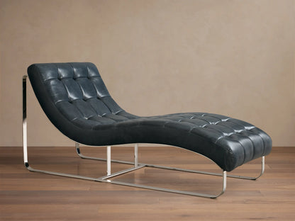 Front view of the dark blue tufted Callaway Leather Chaise, featuring a curved design and polished chrome frame.
