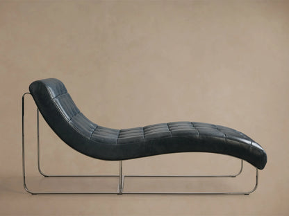 Side view of a black Callaway Leather Chaise, featuring a tufted seat and polished chrome frame.