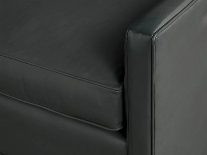 Front view of a dark grey leather Rudy Swivel Chair. Features a boxy design with a visible black swivel base.