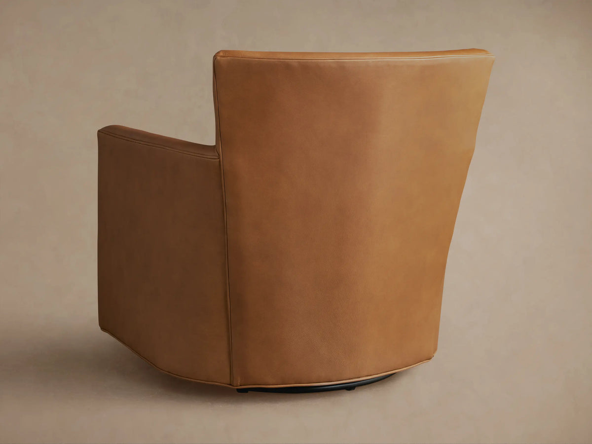 Cognac Rudy Leather Swivel Chair, close-up of armrest, seat cushion, and backrest, showcasing smooth texture and fine stitching.