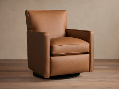 Tan leather Rudy swivel recliner, square arms & back, with a plump seat cushion, on a dark round swivel base, on wood floor.
