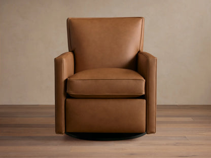 Tan leather Rudy swivel recliner, square arms & back, with a plump seat cushion, on a dark round swivel base, on wood floor.