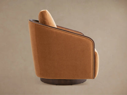 Back of Pomona Swivel Chair, upholstered in rich orange fabric, with a dark curved oak trim and round swivel base.