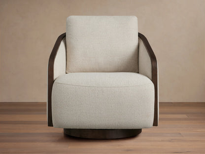 Front-side view of a neutral beige Pomona Swivel Chair with dark wood exposed edges on its arms and base.