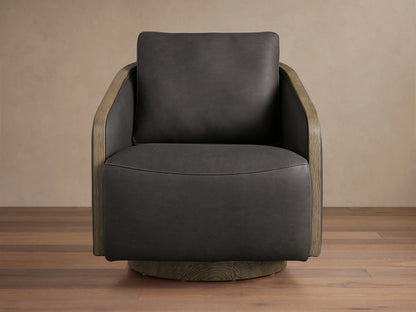 Dark brown leather swivel chair with exposed oak edges on arms and base, featuring soft cushioned seat and backrest on wooden floor.