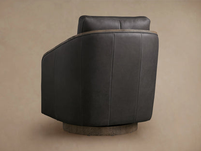 Pomona Leather Swivel Chair in dark brown leather with exposed oak edges on arms and base, featuring soft cushions.