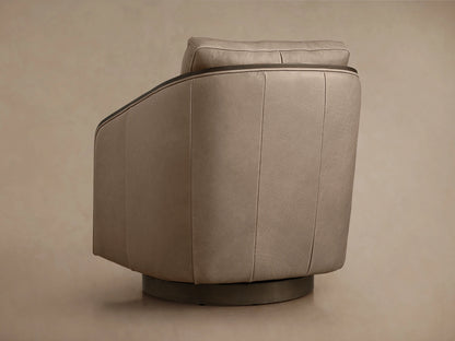 Pomona Leather Swivel Chair with taupe leather upholstery, exposed dark oak armrests, and soft cushion. Close-up view.