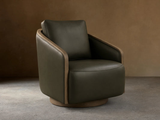 Front view of the dark olive green leather Pomona Leather Swivel Chair with exposed oak arms and a round swivel base.