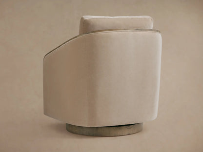 Pomona Swivel Chair in a side view, featuring neutral beige fabric, exposed oak edges, and a solid base. Soft cushions visible.