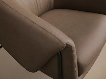 Front view of a taupe Linus Leather Chair, featuring a rounded silhouette, detailed stitching, and black metal frame legs.