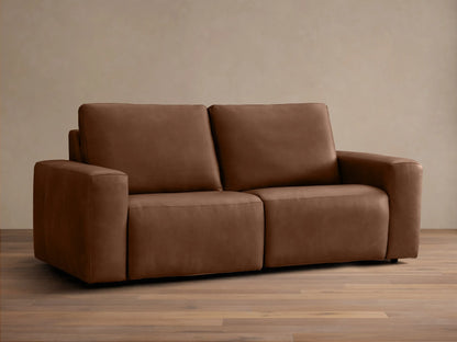 Front view of a brown Brennan Leather Two-Piece Motion Sofa™ with two seats, plush back and seat cushions, and wide block arms.