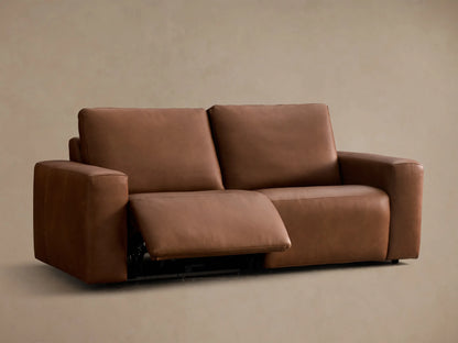 Rear view of the brown Brennan Leather Two-Piece Motion Sofa, featuring two separate back cushions and leather upholstery.