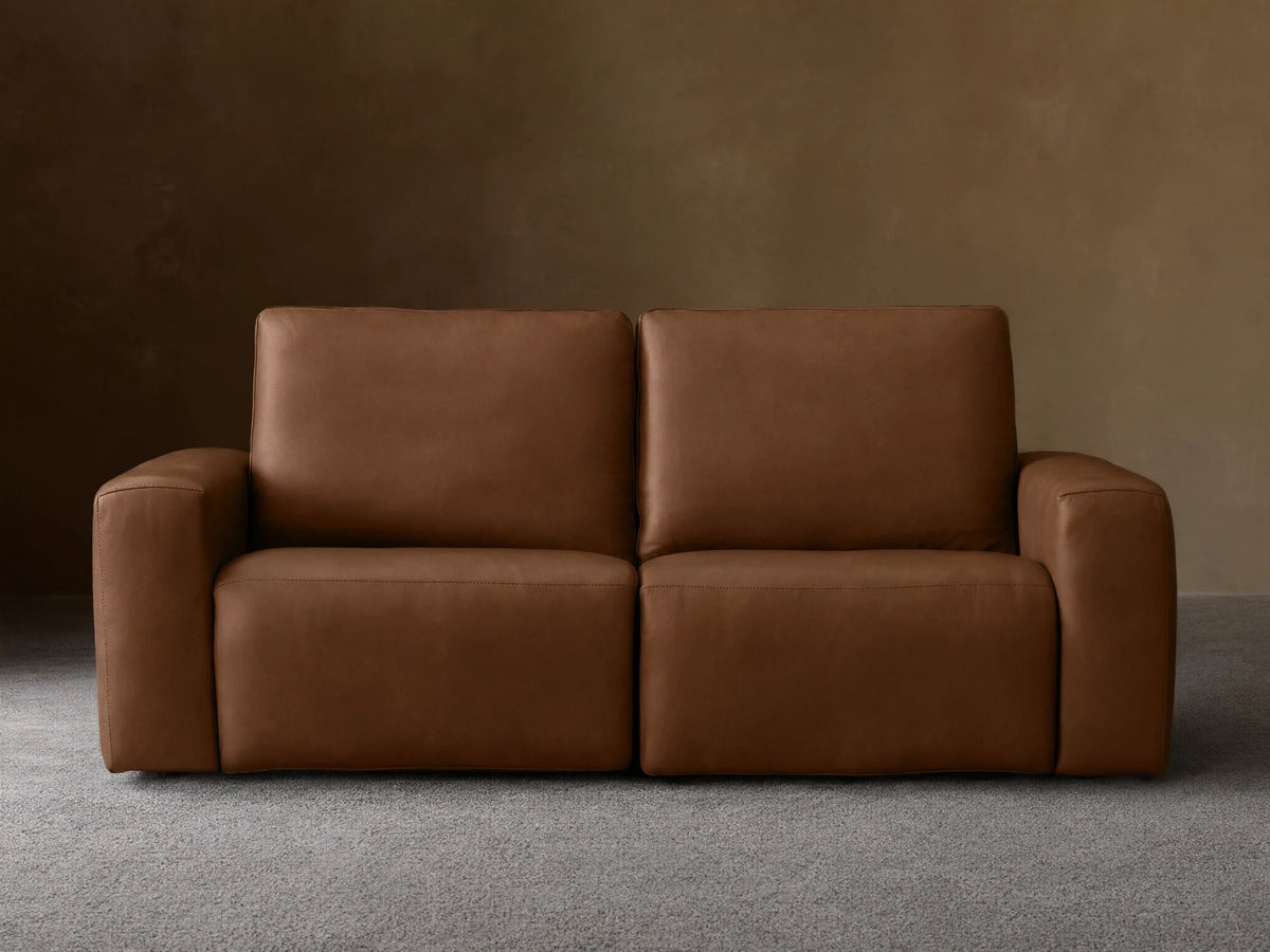 Front view of a brown Brennan Leather Two-Piece Motion Sofa™ with two seats, plush back and seat cushions, and wide block arms.
