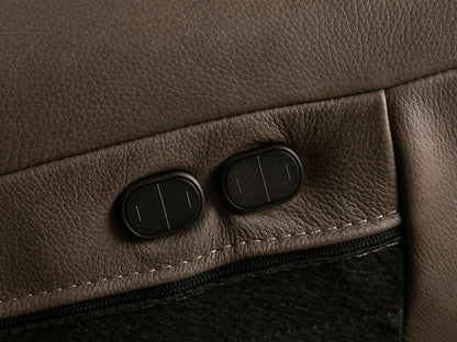 Front view of the brown Brennan Leather Two-Piece Motion Sofa with wide armrests and visible stitching on the cushions.