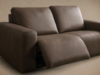 Close-up of brown Brennan Leather Two-Piece Motion Sofa with two black motion control buttons, white stitching, and zipper.