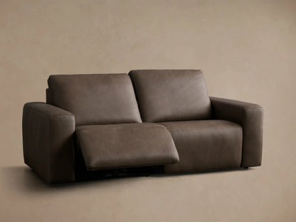 Front view of a dark brown Brennan Leather Two-Piece Motion Sofa with the right recliner extended.