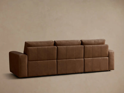 Close-up of the brown leather on the Brennan Leather Three-Piece Motion Sofa, highlighting the texture and cushion stitching.