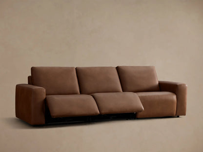 Rear view of the brown leather Brennan Leather Three-Piece Motion Sofa™.