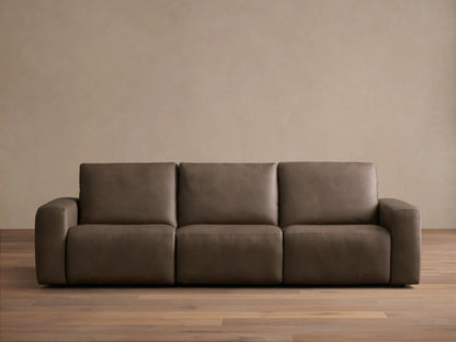 Front view of the brown leather Brennan Leather Three-Piece Motion Sofa, featuring three seats and wide squared arms.