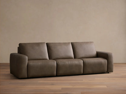 Front view of the brown leather Brennan Leather Three-Piece Motion Sofa, featuring three seats and wide squared arms.