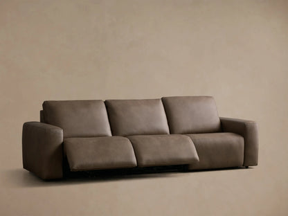Front view of a taupe Brennan Leather Three-Piece Motion Sofa with the rightmost recliner extended.