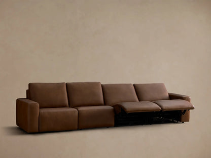 Rear view of the brown Brennan Leather Four-Piece Motion Sectional, showing the back of the four recliner sections.