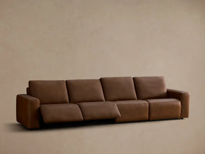Front view of the brown Brennan Leather Four-Piece Motion Sectional with two right recliners extended.