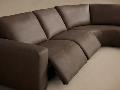 Close-up of the brown leather upholstery and black two-button motion controls on the Brennan Leather Five-Piece Motion Corner Sectional.