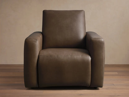 Front view of the brown Brennan Leather Motion Recliner, featuring smooth leather upholstery and stitched seams.