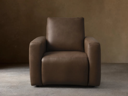 Front view of the brown Brennan Leather Motion Recliner, featuring smooth leather upholstery and stitched seams.