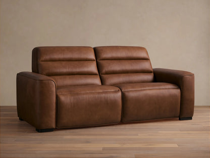 Front view of Borough Leather Two-Piece Motion Sofa, rich warm brown leather, modern design with two seats, horizontally tufted back.