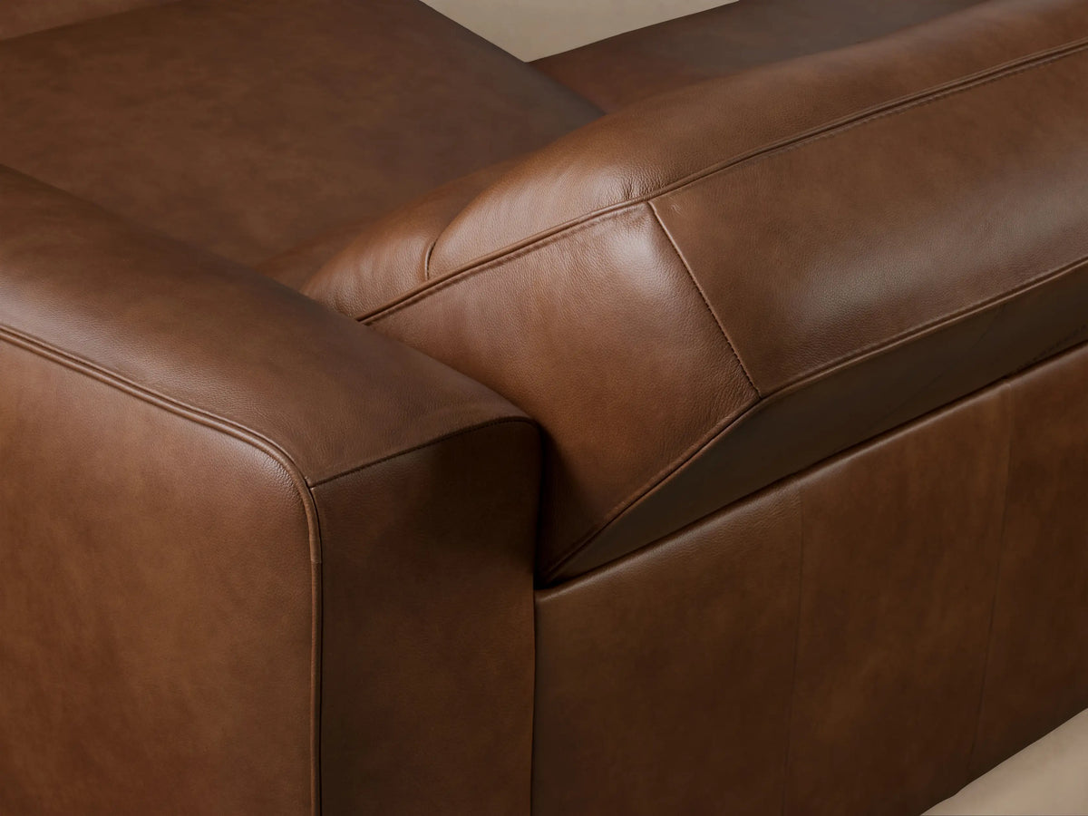 Back view of a Borough Leather Two-Piece Motion Sofa in rich brown leather, showing two distinct reclining sections.