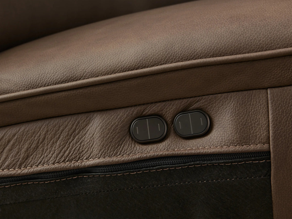 Dark brown Borough Leather Two-Piece Motion Sofa, showing two seats, padded backrests & wide arms, on a wood floor.