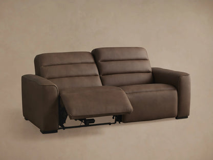Borough Leather Two-Piece Motion Sofa, brown, right seat reclined with footrest extended, left seat upright.