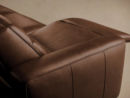 Borough Three-Piece Motion Sofa in rich brown leather, showing three sections with distinct seat/back cushions, on wood floor.