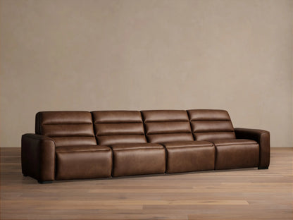Borough Leather Four-Piece Motion Sectional, front view, rich brown leather, against a light beige wall on a wood floor.